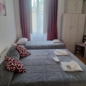 Posteľ alebo postele v izbe v ubytovaní B&B Appartamenti NAPOLI
