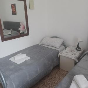 Posteľ alebo postele v izbe v ubytovaní B&B Appartamenti NAPOLI