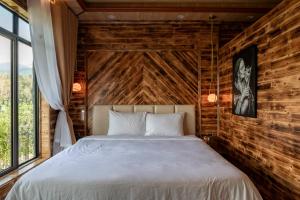Postel nebo postele na pokoji v ubytování The Mong Garden Homestay SaPa