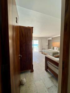 Postel nebo postele na pokoji v ubytování El Paraiso Hotel Tulum