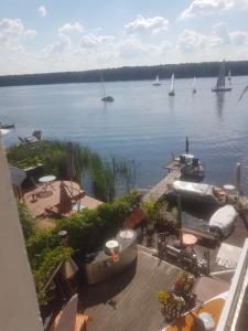a view of a large body of water with sailboats at Dachgeschosswohnung im Haus am See von Berlin in Zeuthen