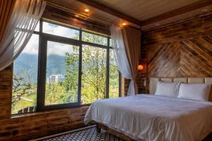 Postel nebo postele na pokoji v ubytování The Mong Garden Homestay SaPa