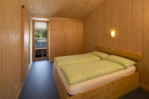 Rúm í herbergi á Familienhotel Campagna