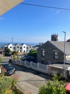 a view from the balcony of a house at Cornish Cottage in Newquay