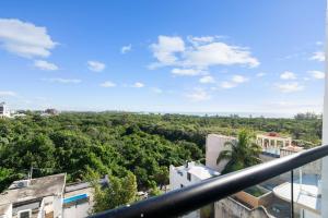 a view from the balcony of a building with trees at Suite Jungle Studio with Views Walk Everywhere in Playa del Carmen