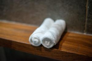 a stack of white towels sitting on a table at Suite Jungle Studio with Views Walk Everywhere in Playa del Carmen