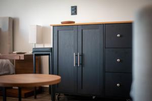 a blue cabinet with a wooden top next to a desk at Suite Jungle Studio with Views Walk Everywhere in Playa del Carmen