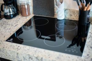 a stove top oven in a counter top at Suite Jungle Studio with Views Walk Everywhere in Playa del Carmen