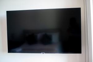 a flat screen tv on a wall at Suite Jungle Studio with Views Walk Everywhere in Playa del Carmen