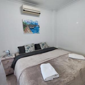 a bedroom with a large bed with a white blanket at Villa SunShine Ciudad Quesada Spain in Ciudad Quesada +30 photos