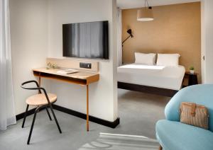 TV a/nebo společenská místnost v ubytování Résidence Callou by Vy Resort Thermal & Spa
