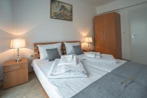 Ένα ή περισσότερα κρεβάτια σε δωμάτιο στο Apartment NORA