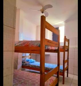 a couple of bunk beds in a room at Yellow house 1 in Salvador