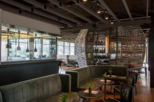 a restaurant with couches and tables in a room at Borgo San Gregorio in Sorbo Serpico