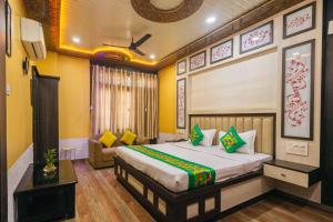 Ένα ή περισσότερα κρεβάτια σε δωμάτιο στο Treebo Saumendra Residency +121 φωτογραφίες