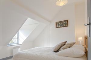 מיטה או מיטות בחדר ב-Appartement de charme
