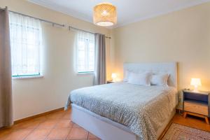 Ένα ή περισσότερα κρεβάτια σε δωμάτιο στο CASA DOS 2 PÁTIOS by Stay in Alentejo