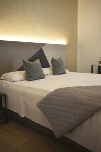Postel nebo postele na pokoji v ubytování Hotel Torino