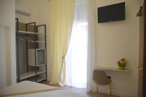 Postel nebo postele na pokoji v ubytování Hotel Torino