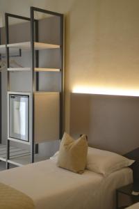 Postel nebo postele na pokoji v ubytování Hotel Torino