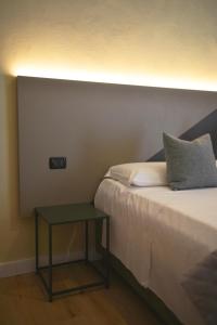 Postel nebo postele na pokoji v ubytování Hotel Torino