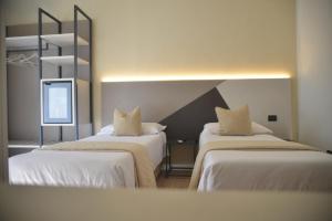 Postel nebo postele na pokoji v ubytování Hotel Torino