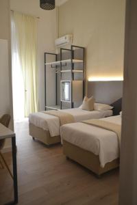 Postel nebo postele na pokoji v ubytování Hotel Torino