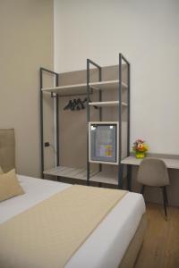 Postel nebo postele na pokoji v ubytování Hotel Torino