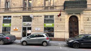 two cars parked in front of a building at Home, far away from Home 2 in Budapest