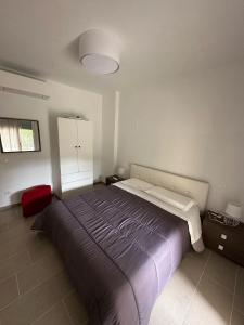 a bedroom with a large bed in a room at Casa vacanza relax in Ortona