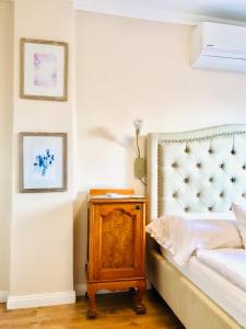 Postel nebo postele na pokoji v ubytování Lux Apartman Villa
