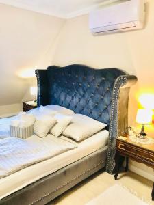 Postel nebo postele na pokoji v ubytování Lux Apartman Villa