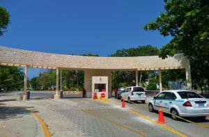 a gas station with cars parked in a parking lot at Perfect Villa with Pool Access and Close to the Beach in Playa del Carmen