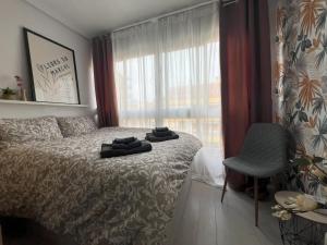 Ένα ή περισσότερα κρεβάτια σε δωμάτιο στο Cosy studio apartment in La Mata