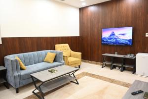 TV a/nebo společenská místnost v ubytování فندق نجمة العزيزية hotel Star AL Aziziyah