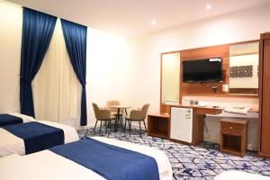 Postel nebo postele na pokoji v ubytování فندق نجمة العزيزية hotel Star AL Aziziyah