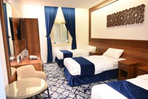 Postel nebo postele na pokoji v ubytování فندق نجمة العزيزية hotel Star AL Aziziyah