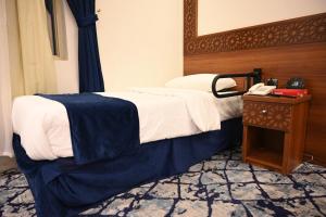 Postel nebo postele na pokoji v ubytování فندق نجمة العزيزية hotel Star AL Aziziyah