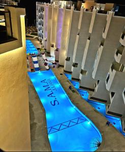 a view of a pool at a resort at night at Seaview 2 Bedroom Private Deluxe Condo at Juliana Beach Resort B2-09 in Hurghada