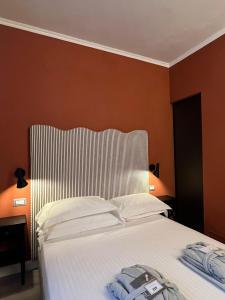 A bed or beds in a room at San Giovanni Terme Rapolano