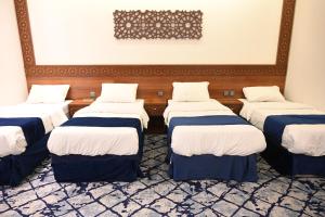 Postel nebo postele na pokoji v ubytování فندق نجمة العزيزية hotel Star AL Aziziyah
