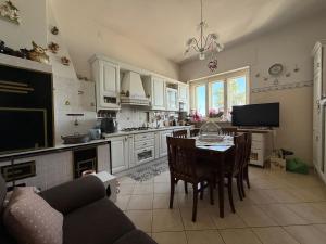 a kitchen with a table and chairs in a room at FronteMare Appartamenti in Otranto