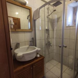 a bathroom with a sink and a shower at Eski Datca Evleri in Datca