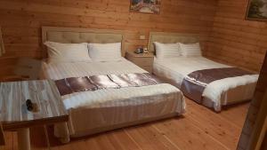 Postel nebo postele na pokoji v ubytování 桃山渡假農場
