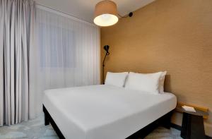 Postel nebo postele na pokoji v ubytování Résidence Callou by Vy Resort Thermal & Spa