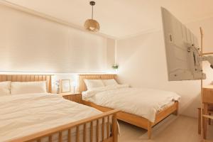 Postel nebo postele na pokoji v ubytování Nldam stay Seoul stn 8min Hongdae 1stop Dongdaemun Myeongdong Gangnam홍대입구1정거장 동대문,명동,강남 인접