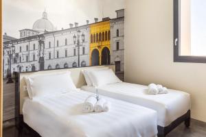 Postel nebo postele na pokoji v ubytování B&B Hotel Brescia
