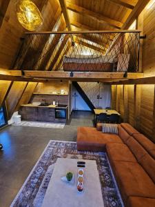 a large living room with a couch and a loft at Luxury Villa Mašić in Čardaci