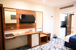 TV a/nebo společenská místnost v ubytování فندق نجمة العزيزية hotel Star AL Aziziyah