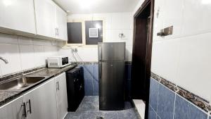 Kuchyň nebo kuchyňský kout v ubytování harmony property + 7 fotografií